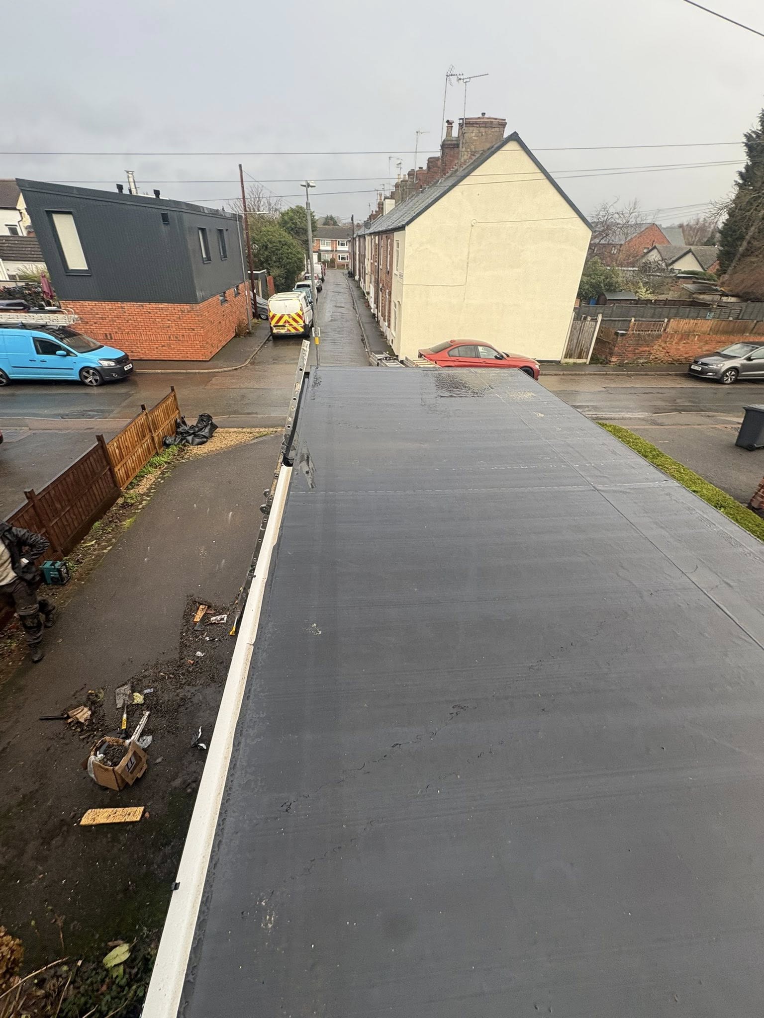 Long narrow rubber roof on garage